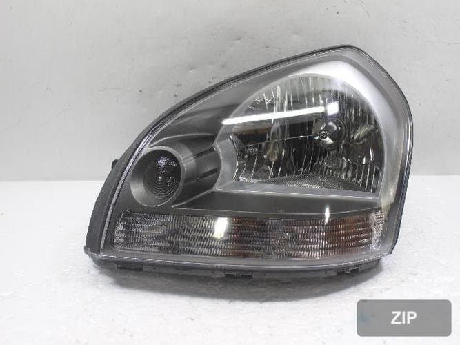 Hyundai Tucson 2008 — фара левая 921012EXXX 1