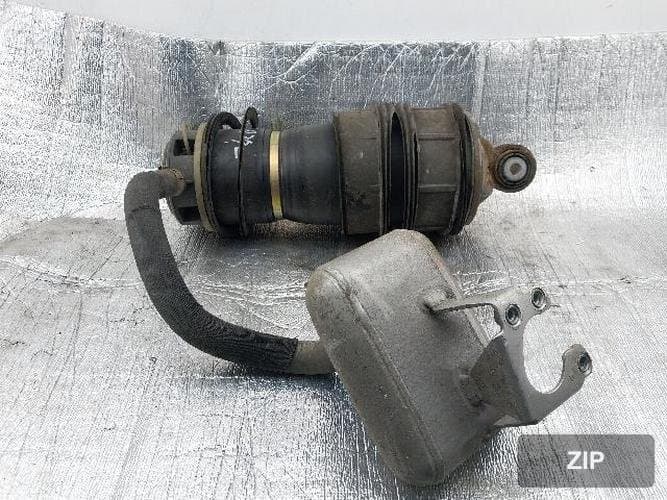 Амортизатор задний левый