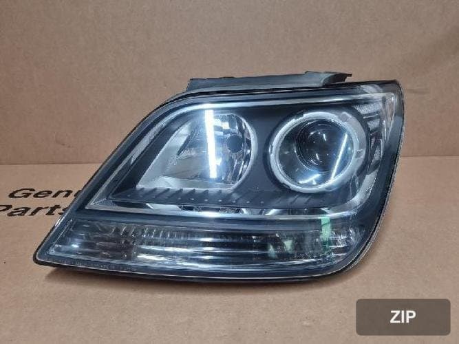 Kia Mohave 2015 — фара левая 921012J570