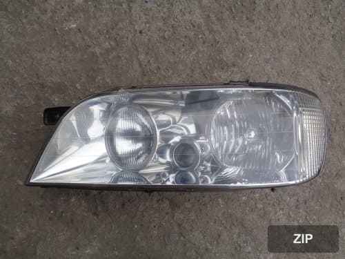 Фара передняя левая HID 921103B011 стекло